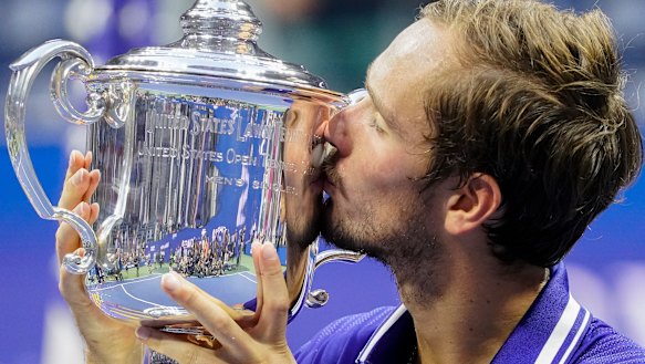 Daniil Medvedev, of Russia, kisses the championship trophy after defeating Novak Djokovic in the men’s singles final of the US Open. 