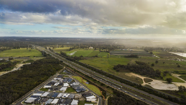 The City of Kwinana looking southwest from Wandi, with the Kwinana Freeway running south through the middle of the frame and the Kwinana industrial area in the distance. Under the framework the industrial area will extend from Rockingham in the south to the city of Cockburn in the north. 