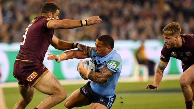 Appetite for destruction: Greg Inglis fells Tyson Frizell during the first match of the State of Origin series.