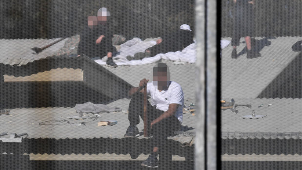 Detainees on the roof of the Frank Baxter Juvenile Justice Centre during a stand-off at the youth prison last week.