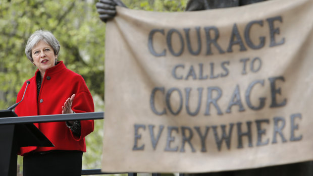 She may need courage: British Prime Minister Theresa May speaks after the unveiling of a statue of women's rights campaigner Millicent Fawcett in Parliament Square, London, last week. 