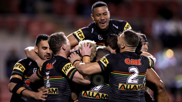 Stephen Crichton (top) celebrates another try for the Panthers.