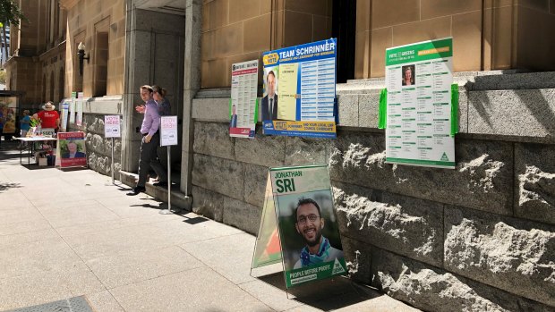 Instead of how-to-vote cards, candidates have had to improvise with large posters people can take photos of on their phone.