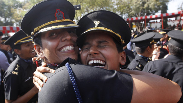 Women cadets celebrate after their graduation ceremony at the Indian Army's Officers Training Academy in Chennai, India.