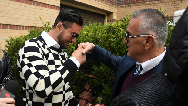 Salim Mehajer greets his father Mohamed Mehajer as he leaves court.