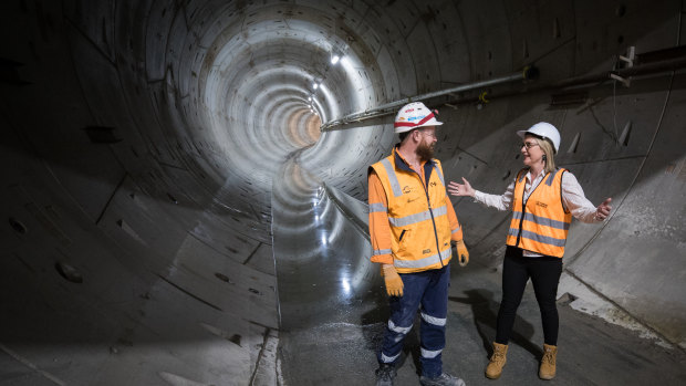 Transport Infrastructure minister Jacinta Allan talks to a tunneling worker underground, in the Metro Tunnel.