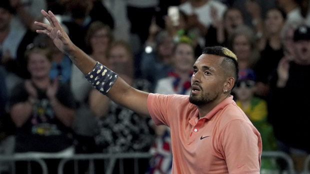 Kyrgios waves to the crowd after his win over Karen Khachanov.