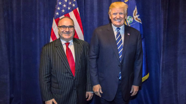 George Nader poses backstage with President Donald Trump at a Republican fundraiser in Dallas. Nader, a convicted paedophile, was told by the Secret Service that he could not meet the President. 
