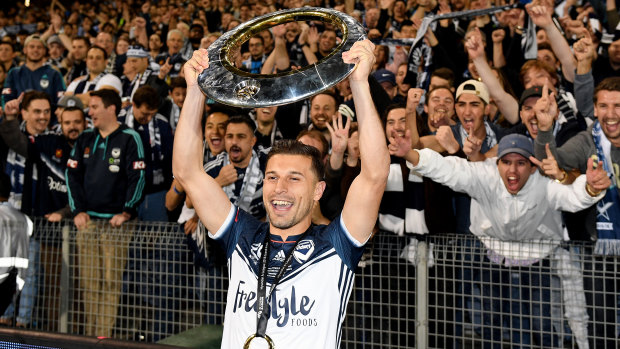 Barbarouses with the premiers' plate after defeating Newcastle 1-0 in the 2018 grand final.