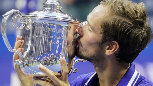 Daniil Medvedev, of Russia, kisses the championship trophy after defeating Novak Djokovic in the men’s singles final of the US Open. 