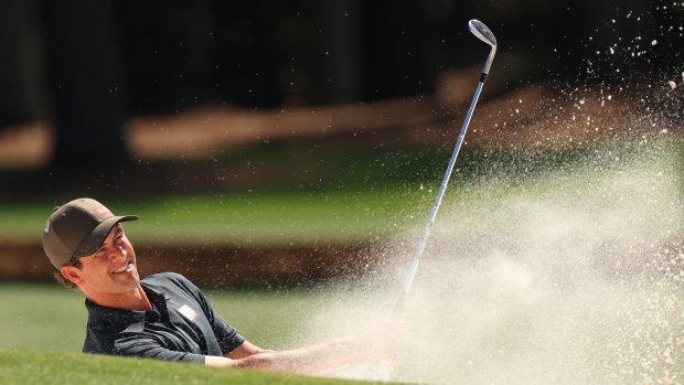 Scott plays a shot from a bunker on the 18th hole during a practice round at Augusta.