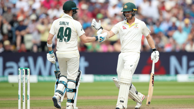 Partners in crime: Smith and Travis Head shared two very important partnerships in the first Test.
