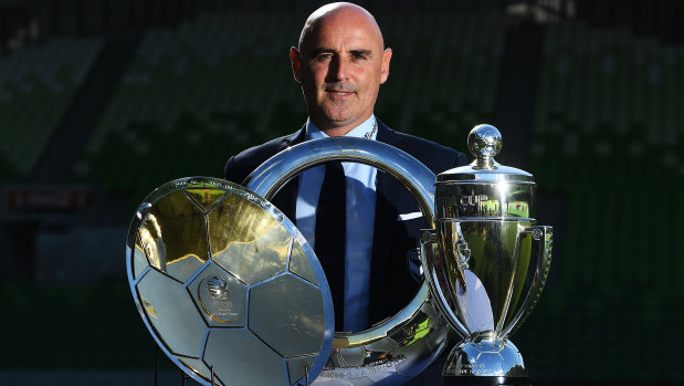 Club legend: Departing Melbourne Victory coach Kevin Muscat with some of his silverware at AAMI Park on Monday.