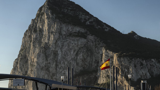 A Spanish flag flies on top of the customs house on the Spanish side of the border with the British overseas territory.