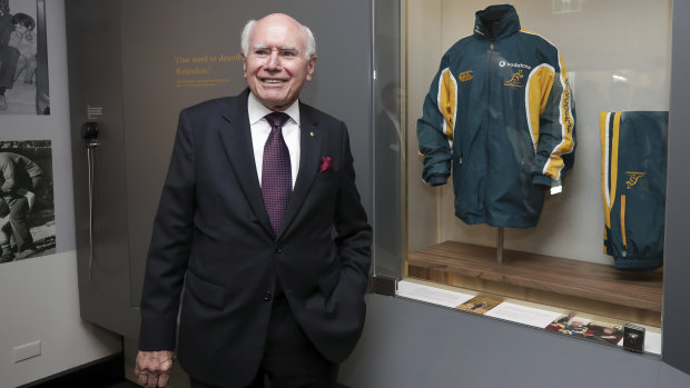 Former Prime Minister John Howard with one of his old tracksuits during the opening of the UNSW Howard Library at Old Parliament House in Canberra on Tuesday 4 December 2018.