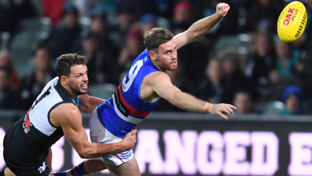 Travis Boak puts the pressure on Hayden Crozier.