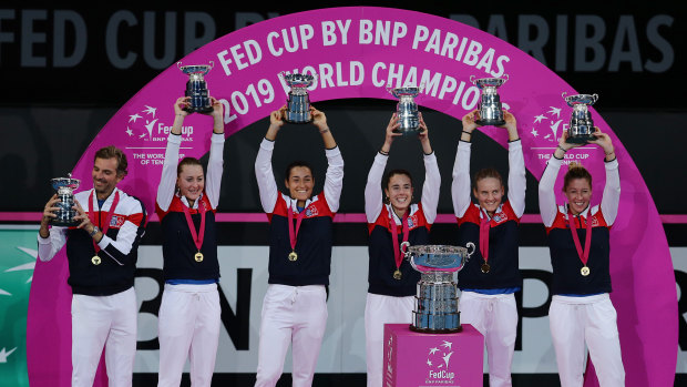 World beaters: Team France show off their silverware after winning the Fed Cup final in Perth.