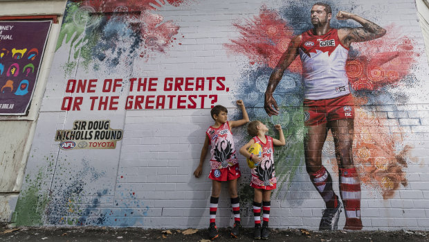 Superstar: Joel and Dillon Hardy admire the Buddy Franklin mural in Darlinghurst.