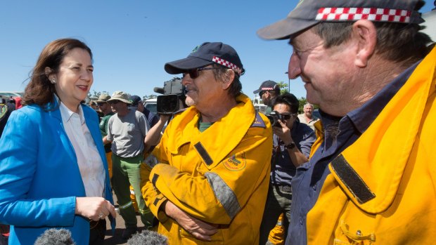 Queensland Premier Annastacia Palaszczuk meets with rural firefighters at the Peregian Springs Control Centre on Thursday.