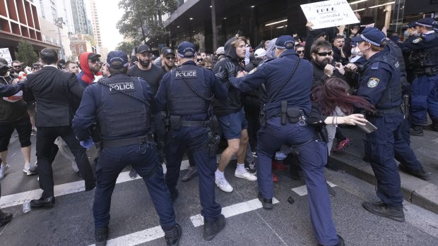 Police interact with demonstrators during an anti-lockdown protest in Sydney’s CBD on July 24.