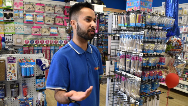 Harshil Dodia, owner of Clarkson's Party Mix store, says he works about 80 hours a week.