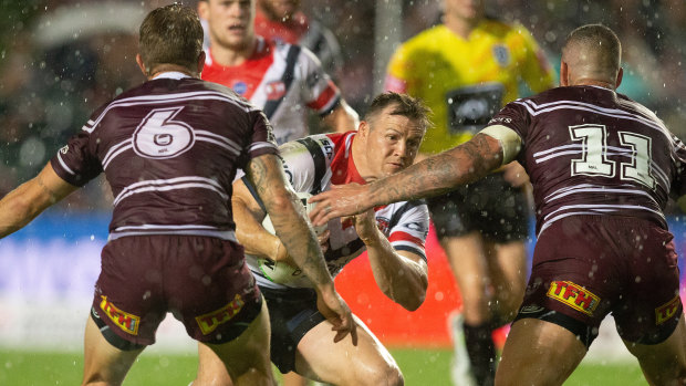Boggy surface: Brett Morris runs the ball up before sustaining a knee injury at Brookvale Oval.