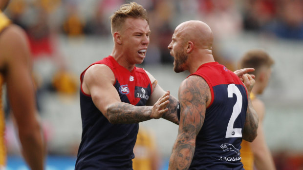 Nathan Jones (right) fires up after slotting a goal.