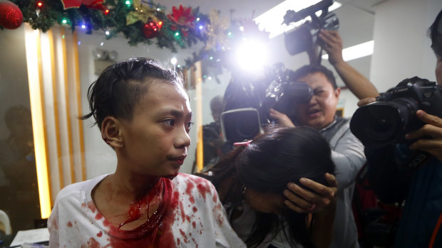 An injured reveller walks into a hospital after raucous new year celebrations in the Philippines.