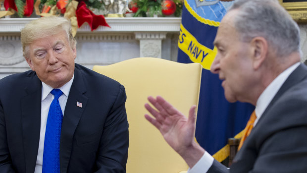 Senate Minority Leader Chuck Schumer, a Democrat from New York, right, speaks while US President Donald Trump listens during a meeting at the Oval Office of the White House in Washington, DC. 