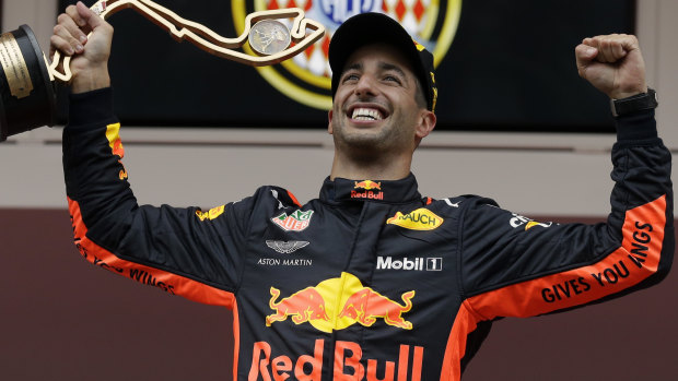 Daniel Ricciardo celebrates on the podium. 
