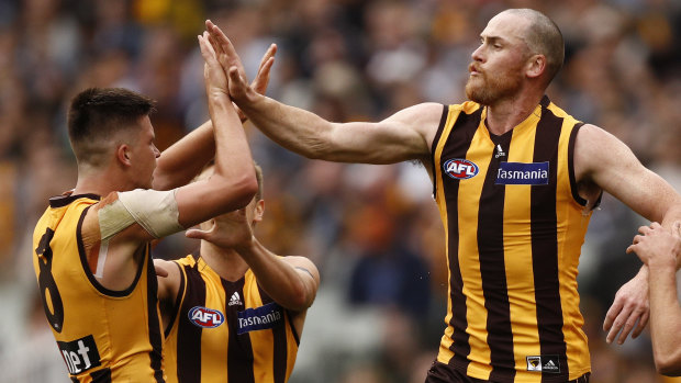Jarryd Roughead (right) congratulates
Mitchell Lewis after combining for a goal . 