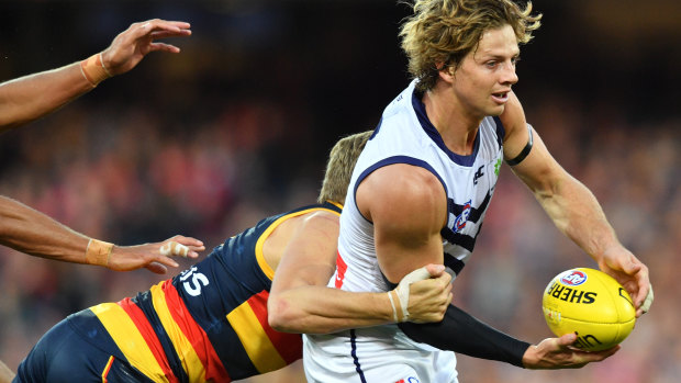 Hugh Greenwood gets to grips with Fremantle captain Nat Fyfe this year.