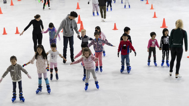 Closure on ice: children learn to skate at Macquarie Ice Rink.