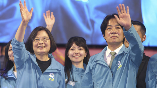 Taiwan President and Democratic Progressive Party presidential candidate Tsai Ing-wen, left, waves to supporters while launching her re-election campaign in Taipei, Taiwan.