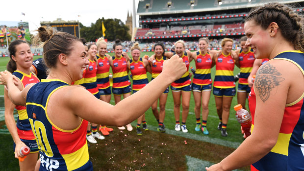 The Crows sing the song after their dominant win over the Cats.