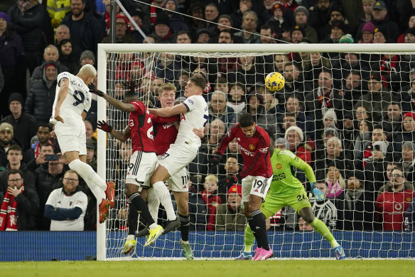 Tottenham’s Richarlison, left, scores his side’s opening goal against Manchester United.
