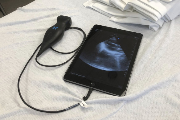 A Butterfly iQ handheld ultrasound device attached to a tablet on a bed at the Indiana University medical school in Indianapolis. The device shows instant images of the heart and other organs, helping doctors diagnose a range of ailments.