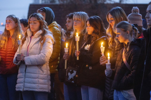Boise State University students, along with people who knew the four University of Idaho students who were found killed. stand in a vigil.