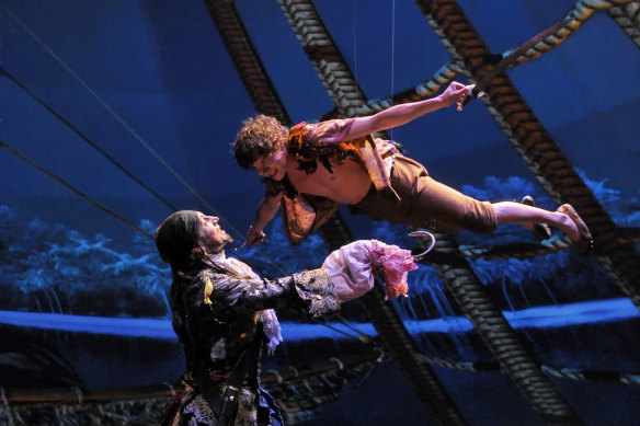 Actors soar above the stage in the London production of <i>Peter Pan. 