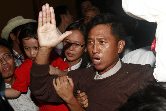 Kyaw Min Yu, a pro-democracy activist better known as Ko Jimmy arrives at Yangon airport welcomed by his wife Nilar Thein, background, also an activist and his daughter after being released from a prison in 2012. He was executed by the junta last month.