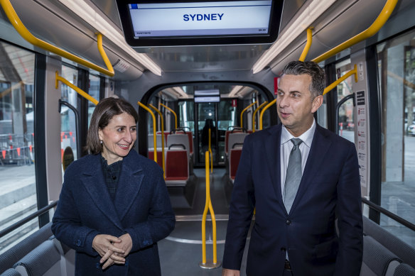 Premier Gladys Berejiklian and Transport Minister Andrew Constance inspect a tram parked at Town Hall.