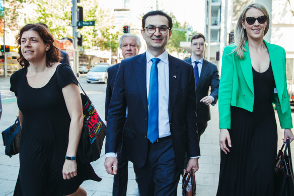 Surgeon Munjed Al Muderis, with his barrister Sue Chrysanthou, SC, (left) and partner Claudia Roberts on Monday.