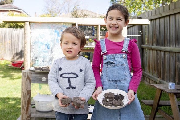 Sophie and William show off their latest mud pies.