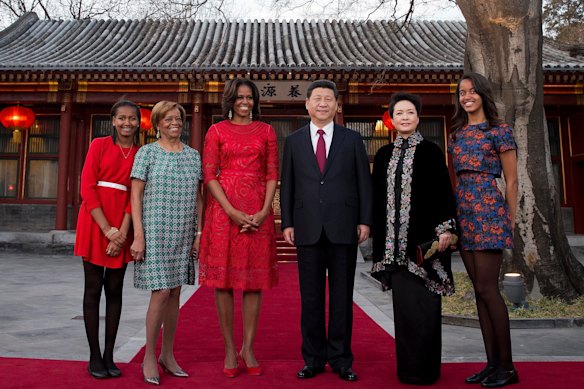 Michelle Obama, her daughters Malia, right, and Sasha, left, and her mother Marian Robinson, second-left, with Chinese President Xi Jinping and his wife Peng Liyuan at the Diaoyutai State guest house in Beijing in 2014.