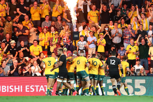 Red Bled redemption: The Wallabies celebrate in Brisbane.