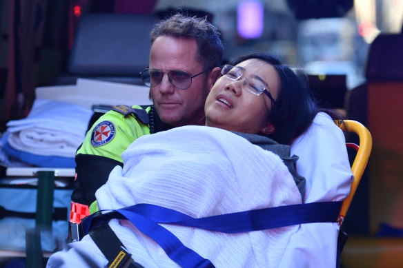 A woman is taken from Hotel CBD on the corner of King and York streets.