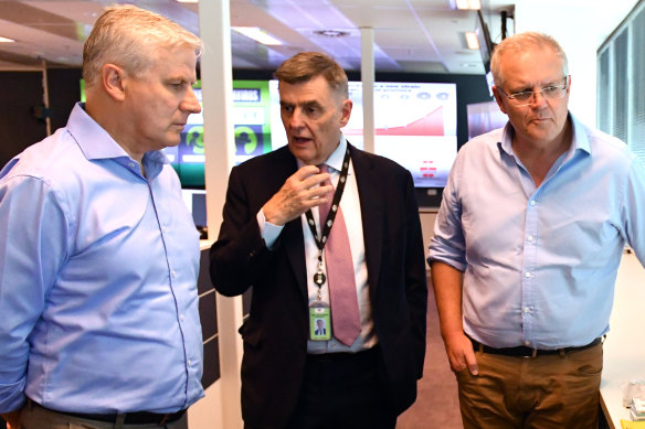 Chief Medical Officer Brendan Murphy gives Deputy Prime Minister Michael McCormack and Prime Minister Scott Morrison an update on coronavirus at the National Incident Room of the Department of Health in Canberra on Wednesday.