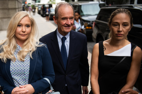 David Boies, representing several of Jeffrey Epstein's alleged victims, centre, arrives with Annie Farmer, right, and Virginia Giuffre.