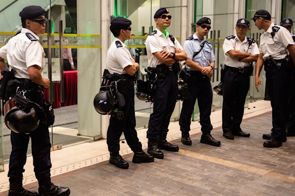 Police stand guard during the community dialogue event. 