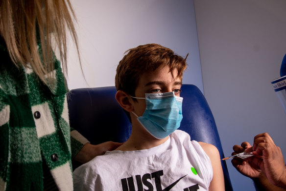 Lucas, 12, has his first vaccination at the Heidelberg Repatriation Hospital, Melbourne. 
Britain’s decision brings the UK into line with countries like Australia which will offer the Pfizer vaccine to the over 12s from Monday.